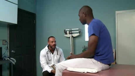 Mature gay doctor takes his patient's big black dick at the office